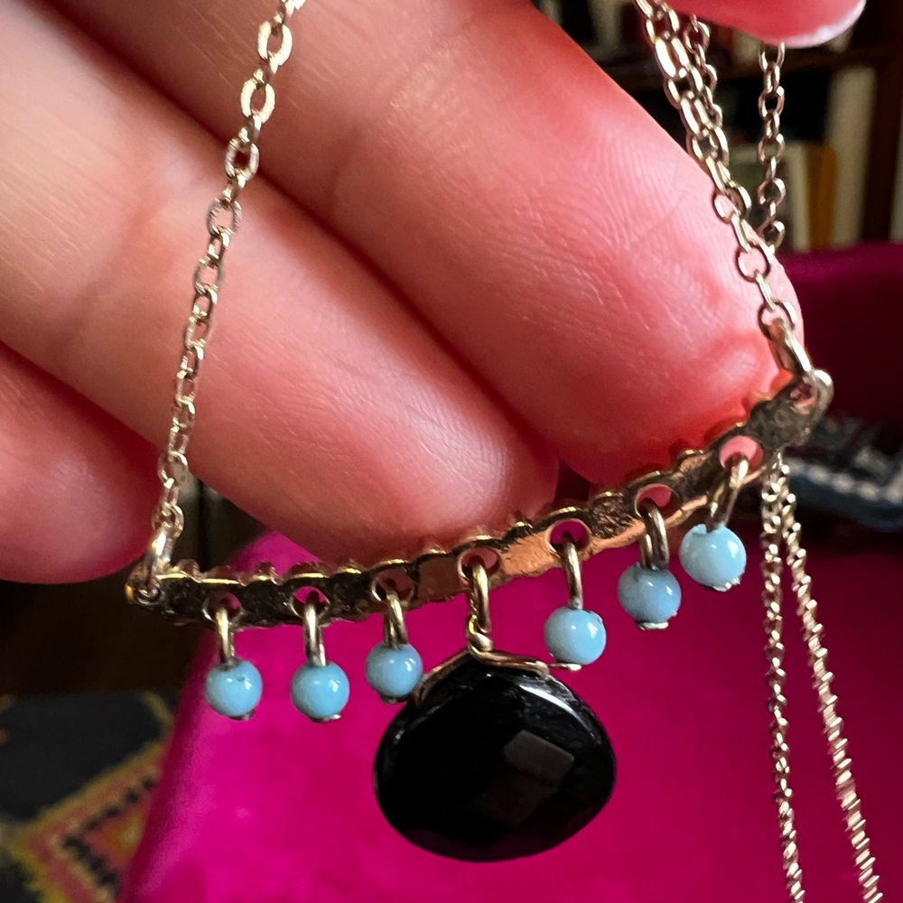 Black, turquoise and gold necklace. 24” chain length.